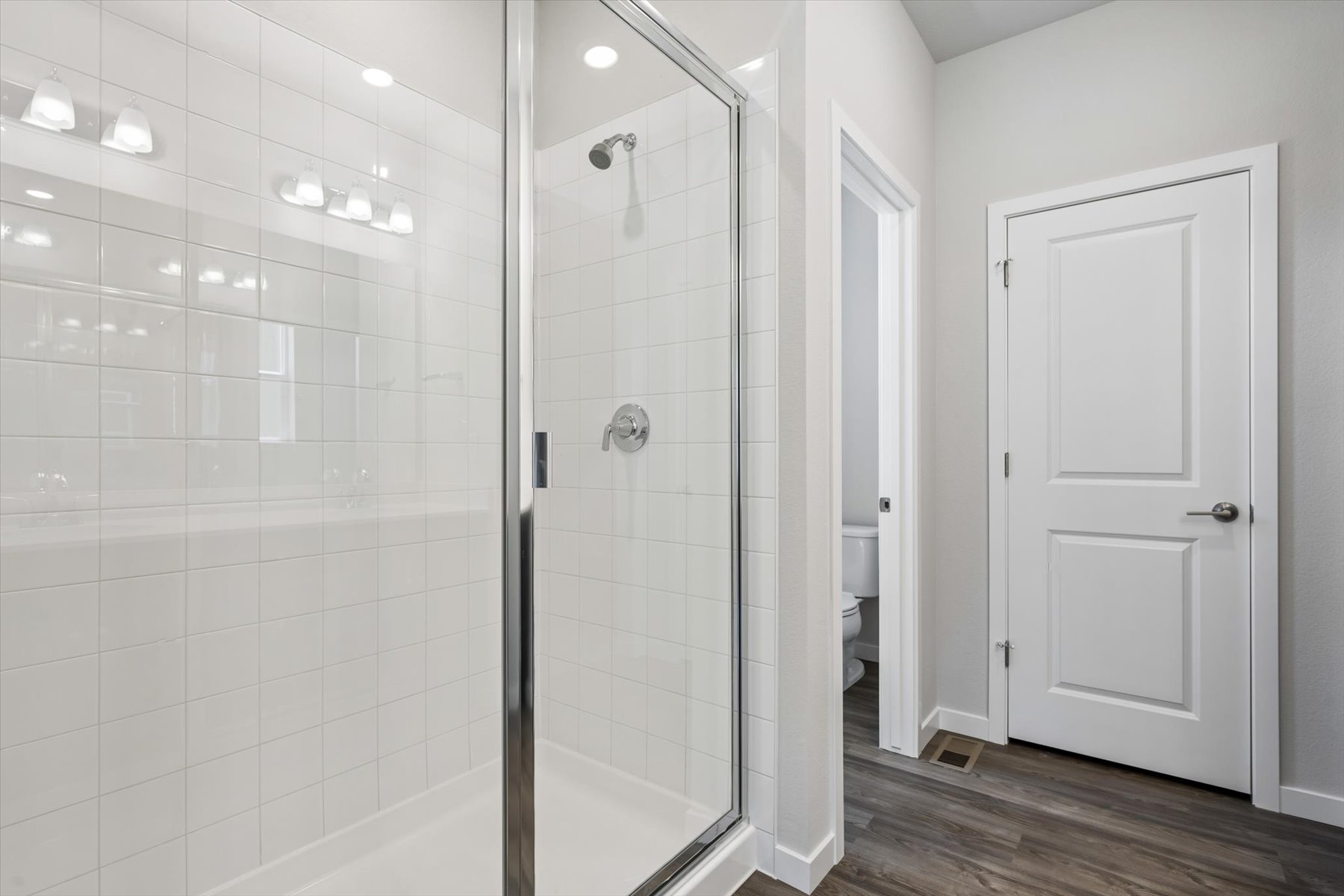A bathroom with a glass shower.