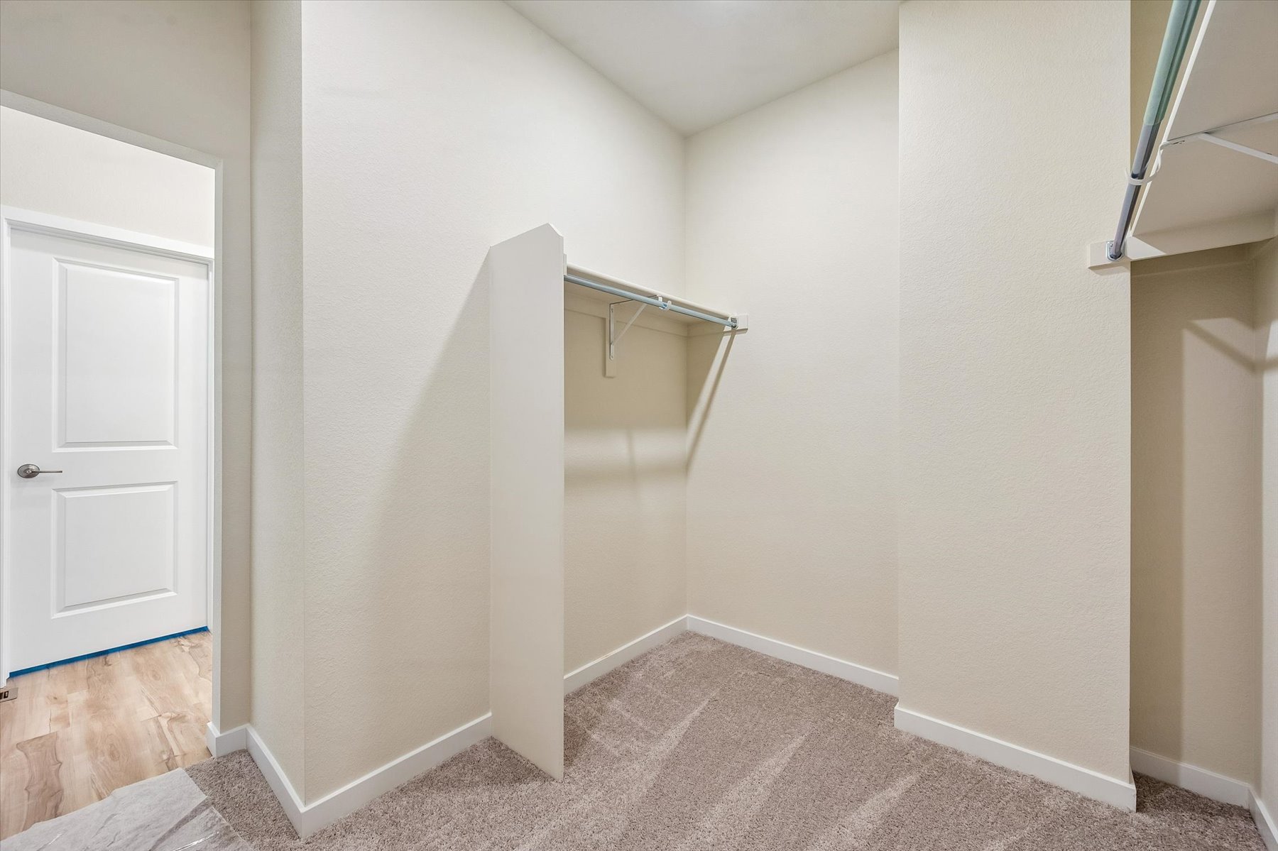 A room with a shower and a door.