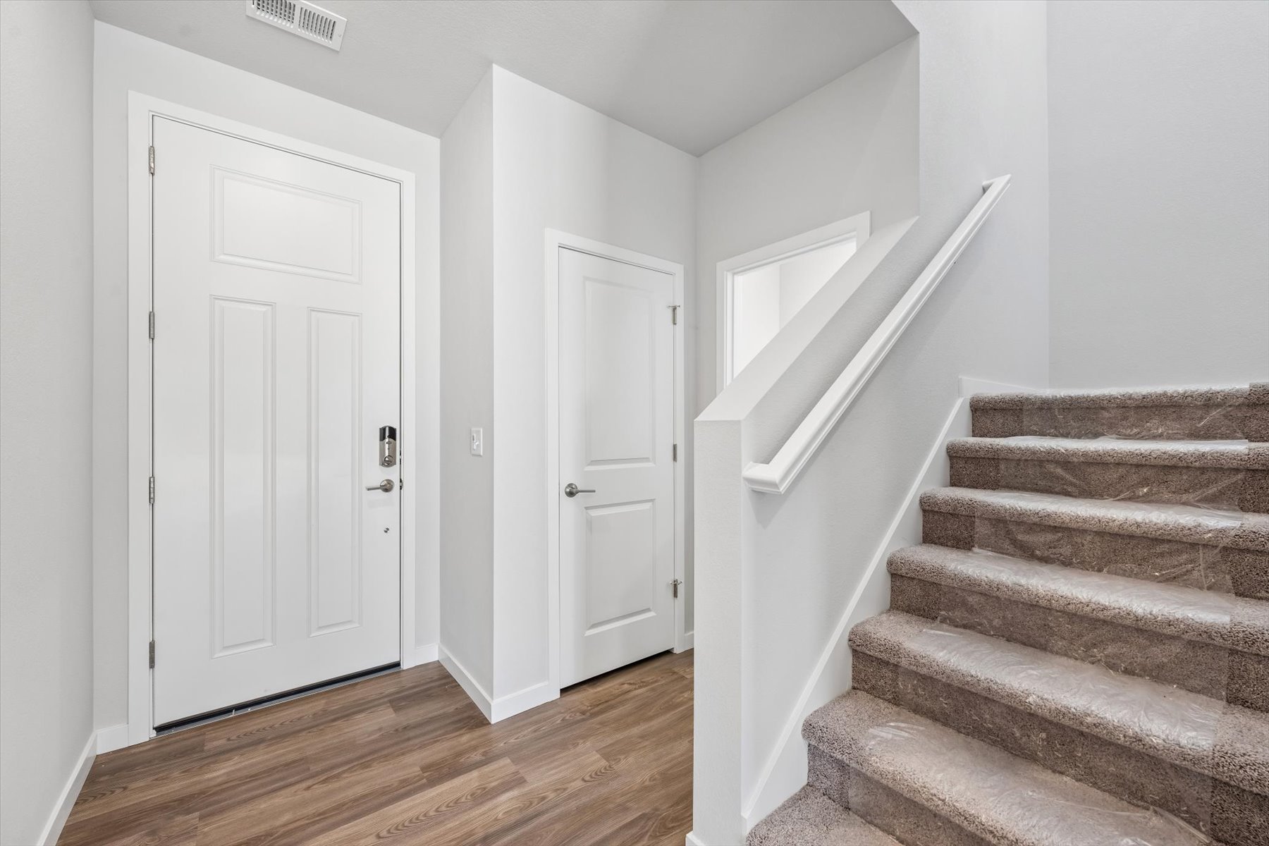 A staircase leading to a door.