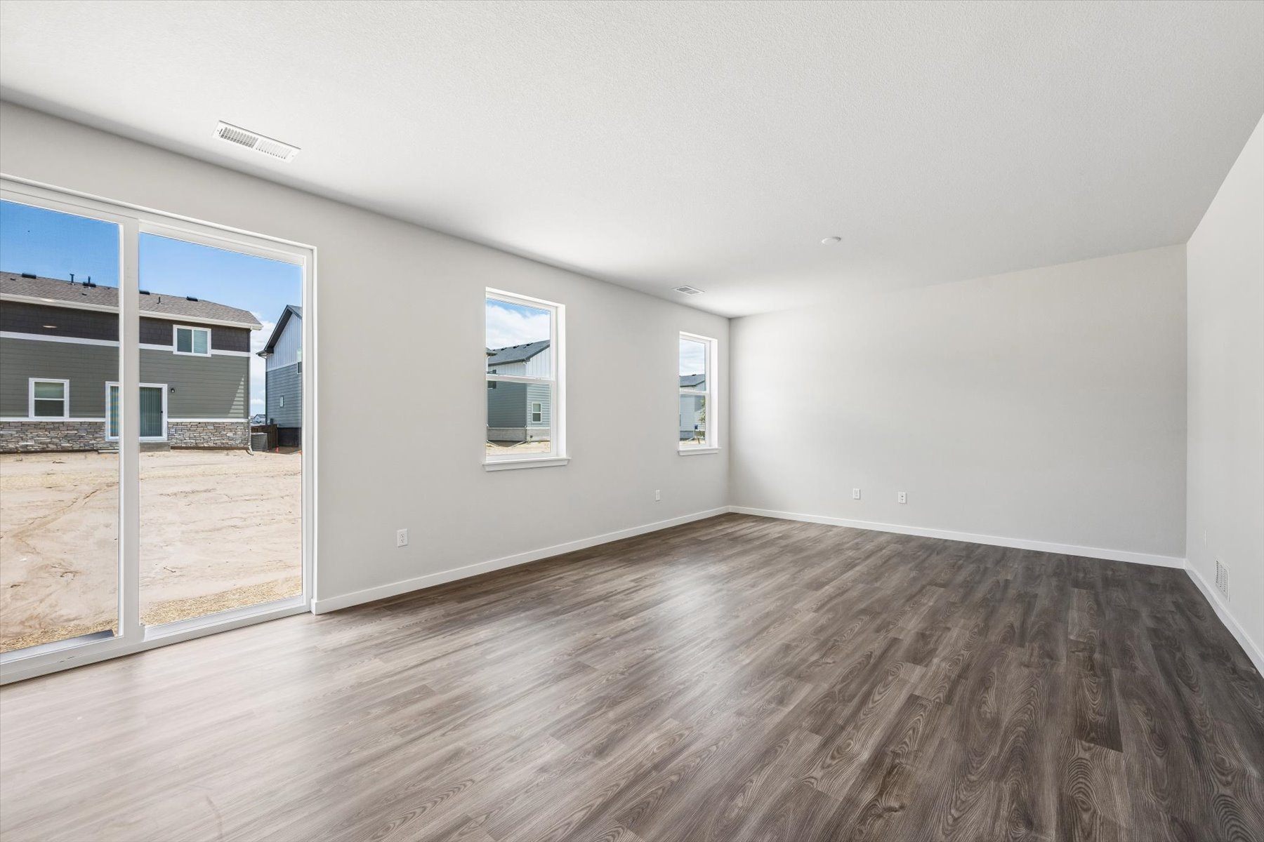 A room with a wood floor and a wood floor.