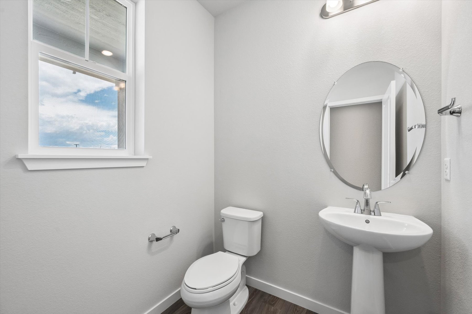 A bathroom with a sink and a mirror.