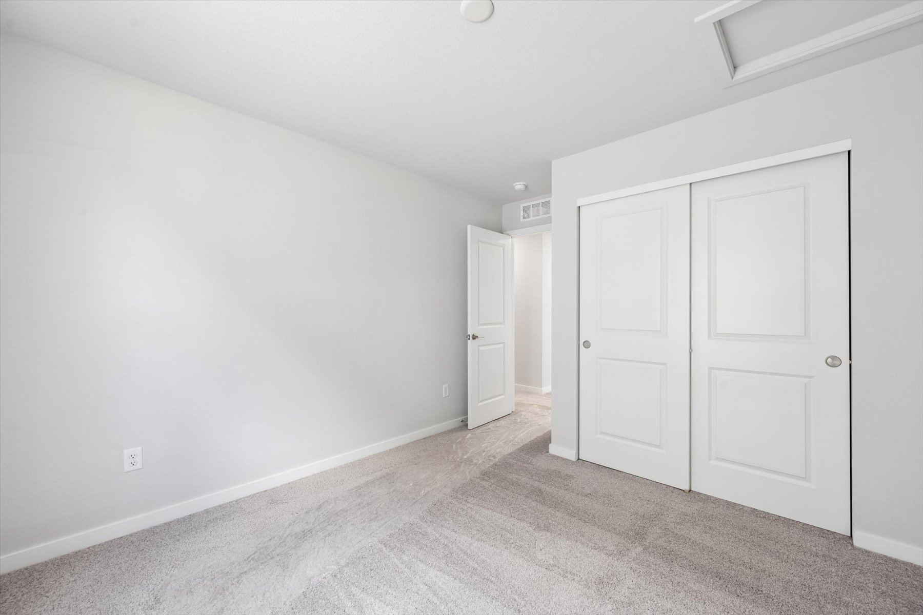 A room with white doors.