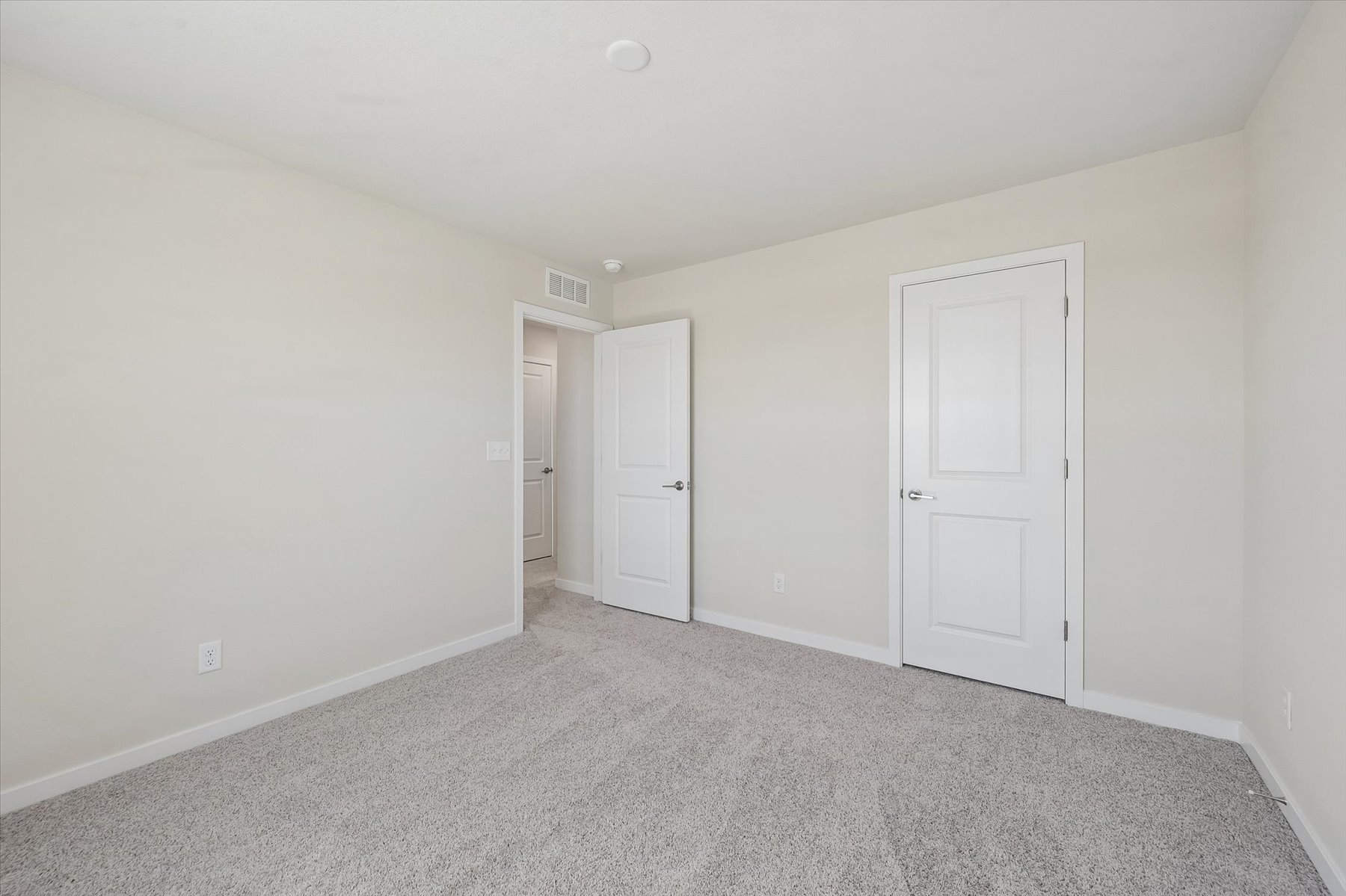 A room with white doors.