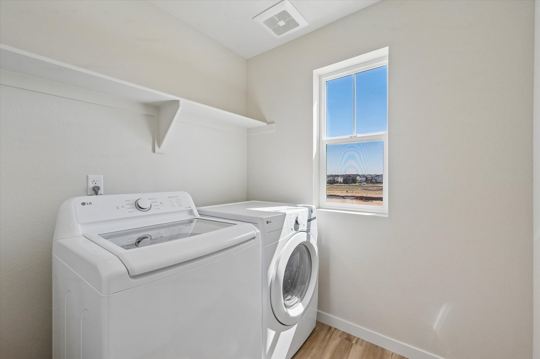 A washing machine in a room.