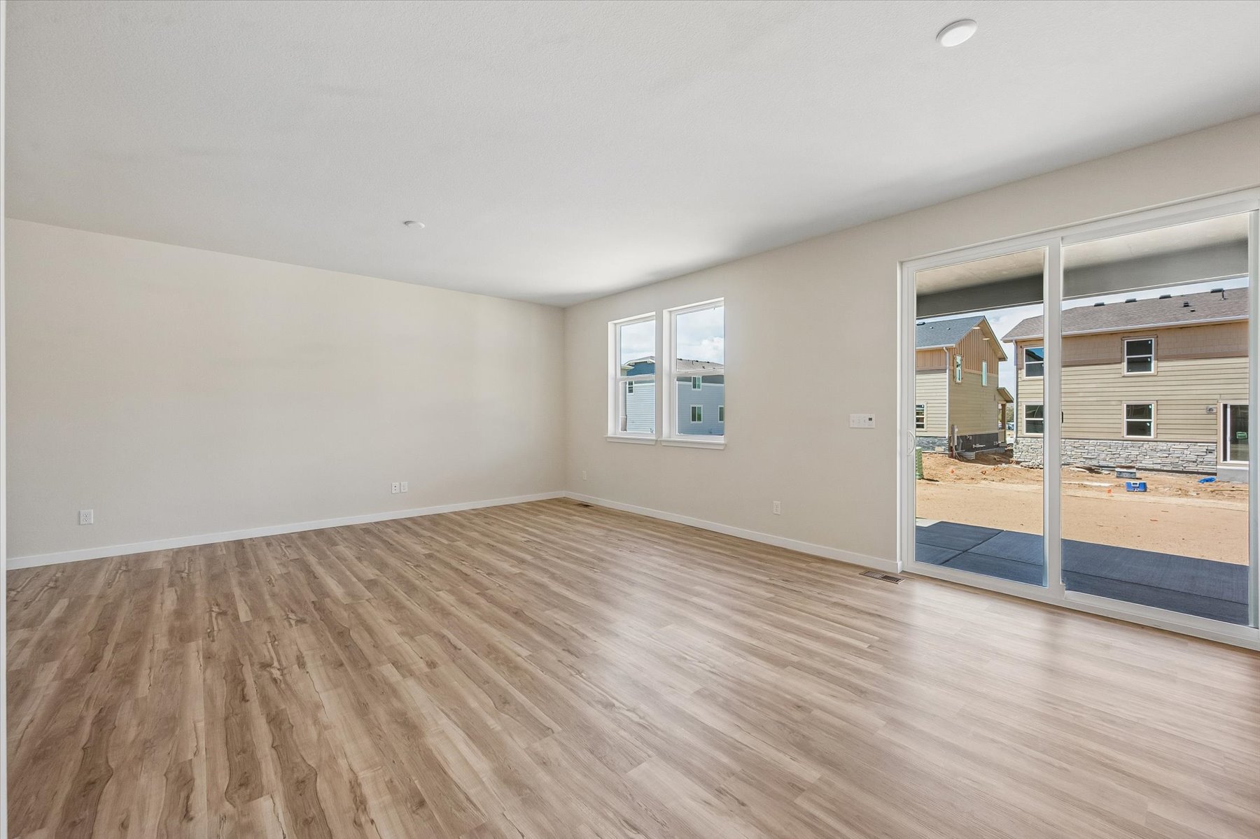 A room with a wood floor and a wood floor.