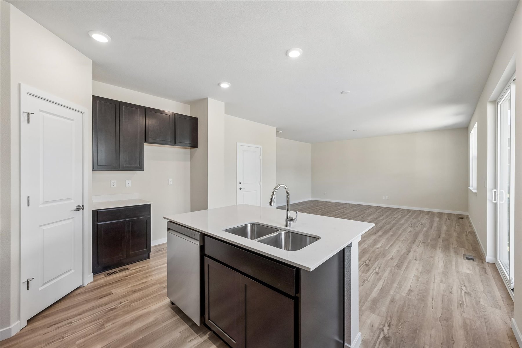 A kitchen with a sink and cabinets.