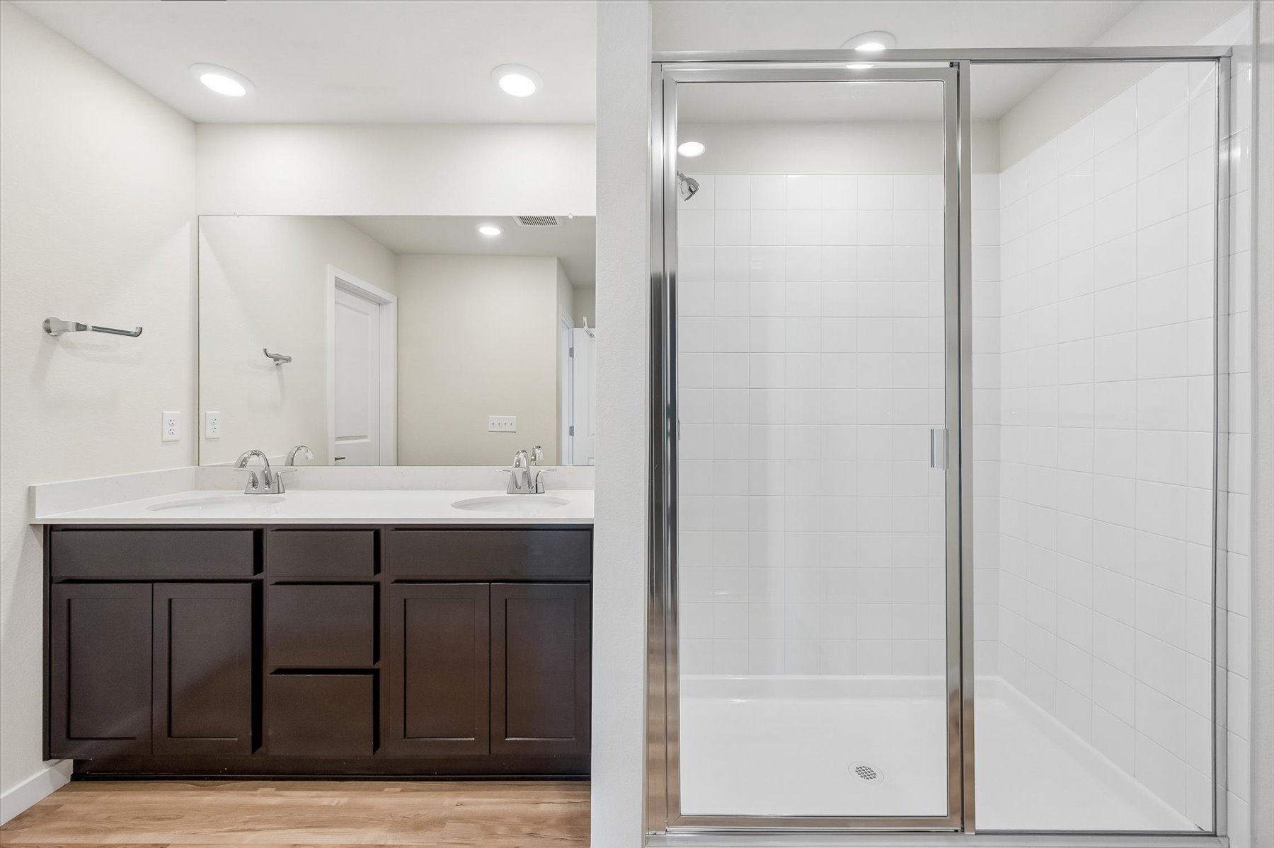 A bathroom with a glass shower.
