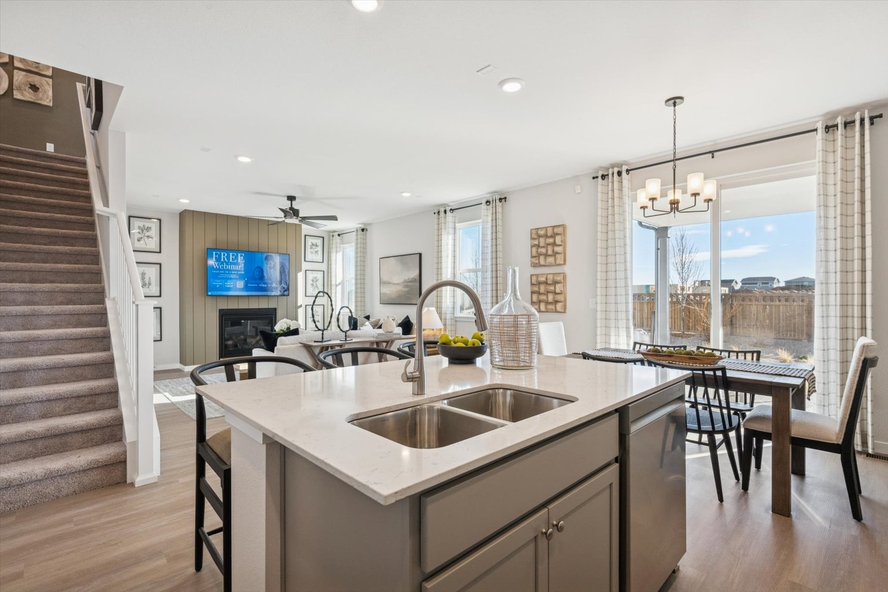 A kitchen with a large window.