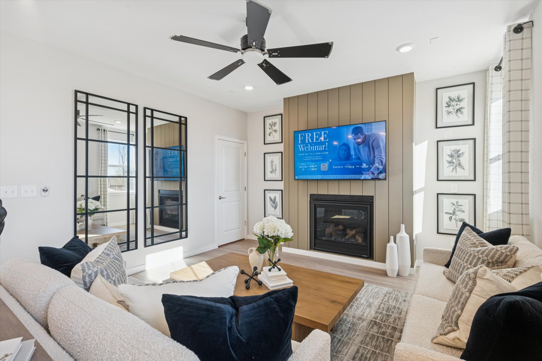 A living room with a fireplace and a tv.