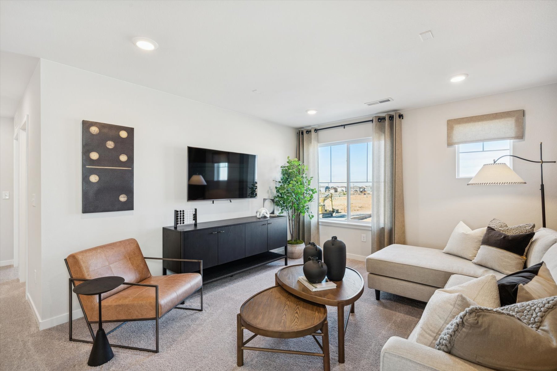 A living room with a tv and couches.