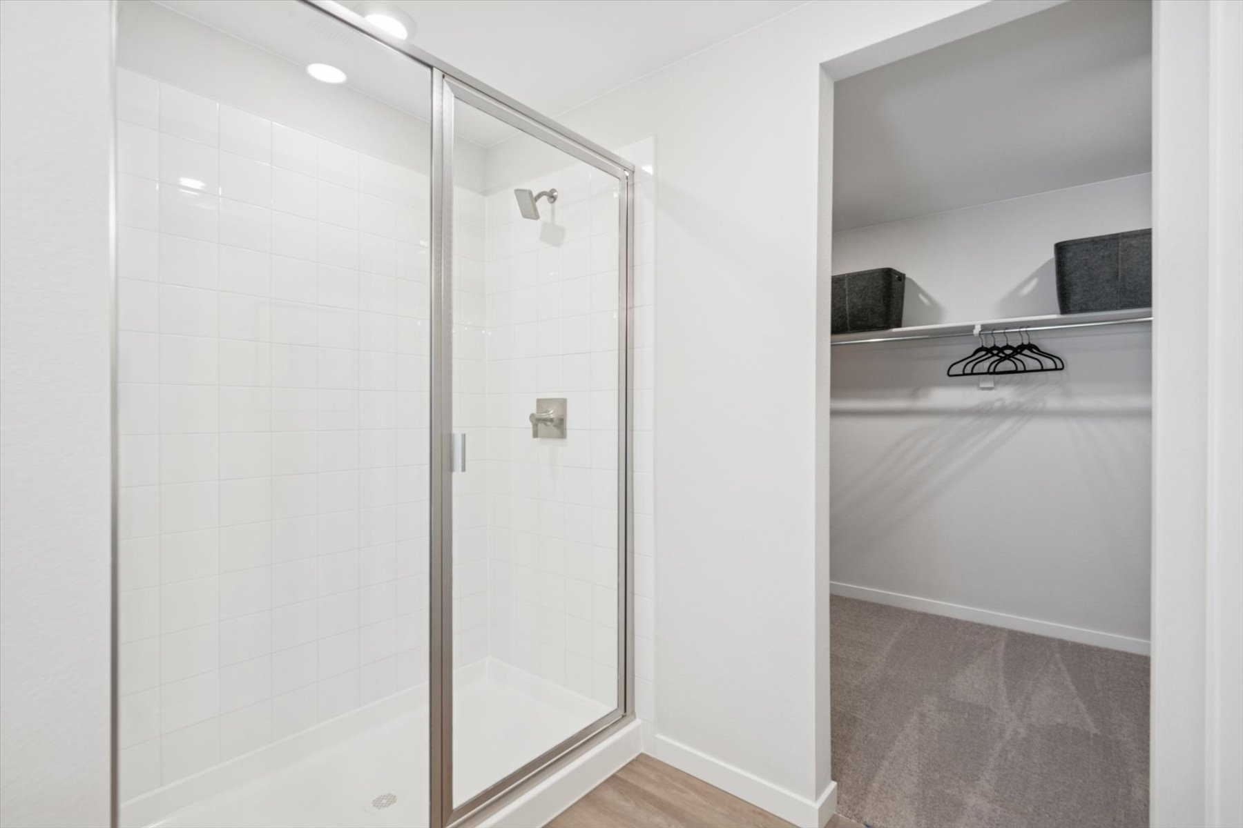 A shower with a glass door.