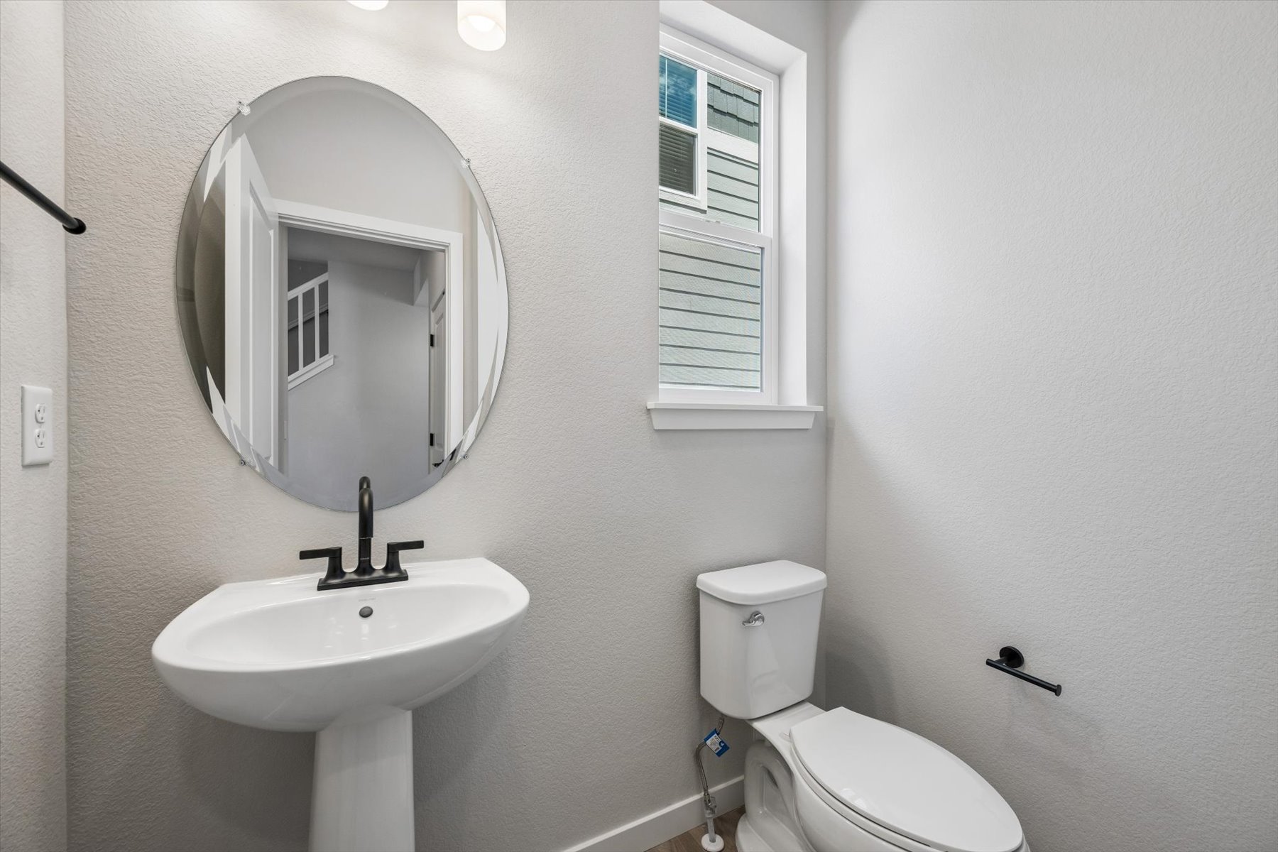 A bathroom with a sink and toilet.