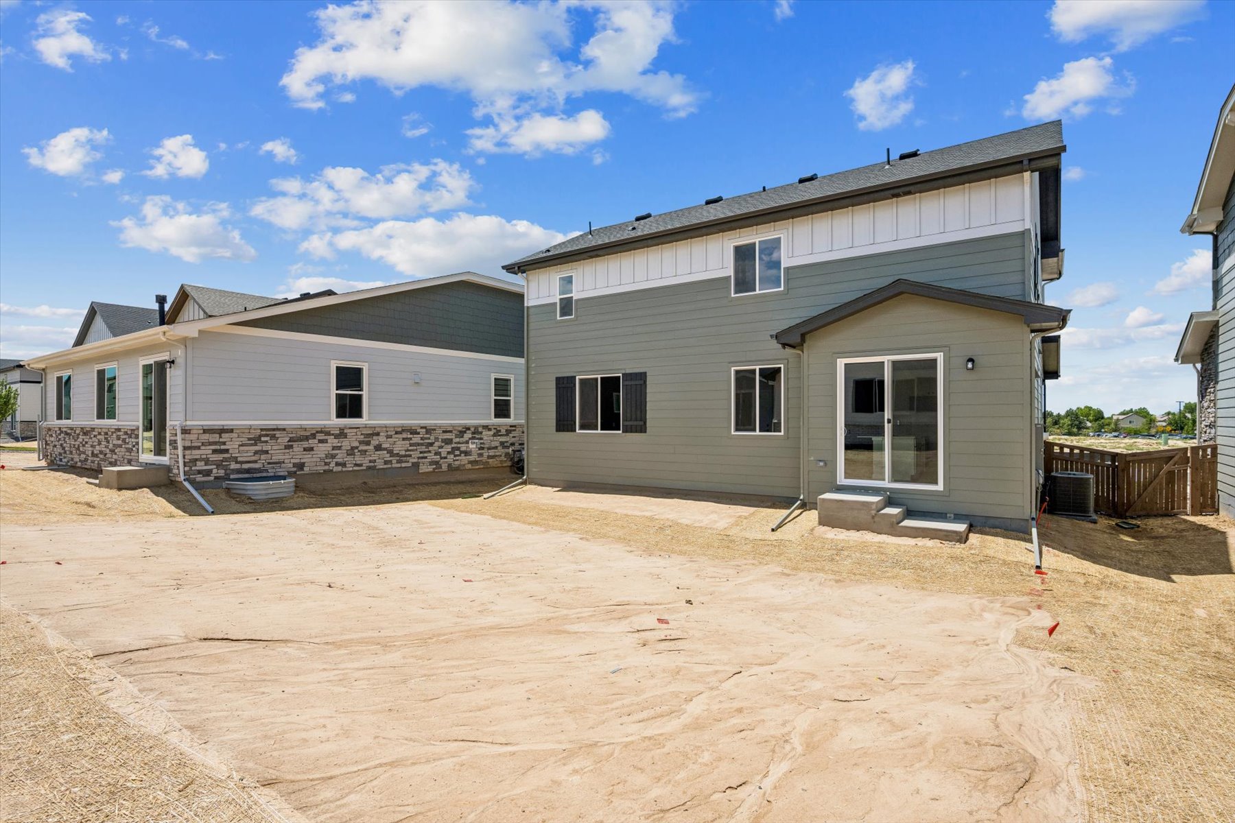 A house with a dirt yard.