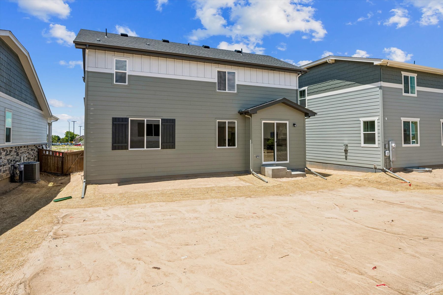 A house with a dirt yard.