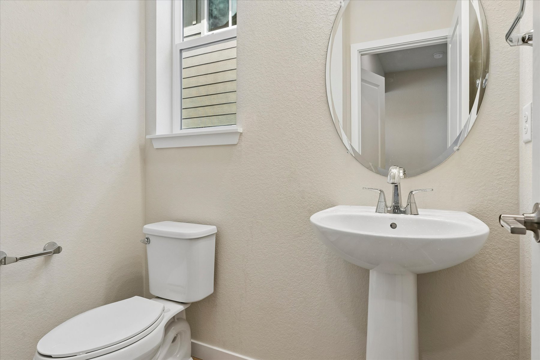 A bathroom with a sink and toilet.