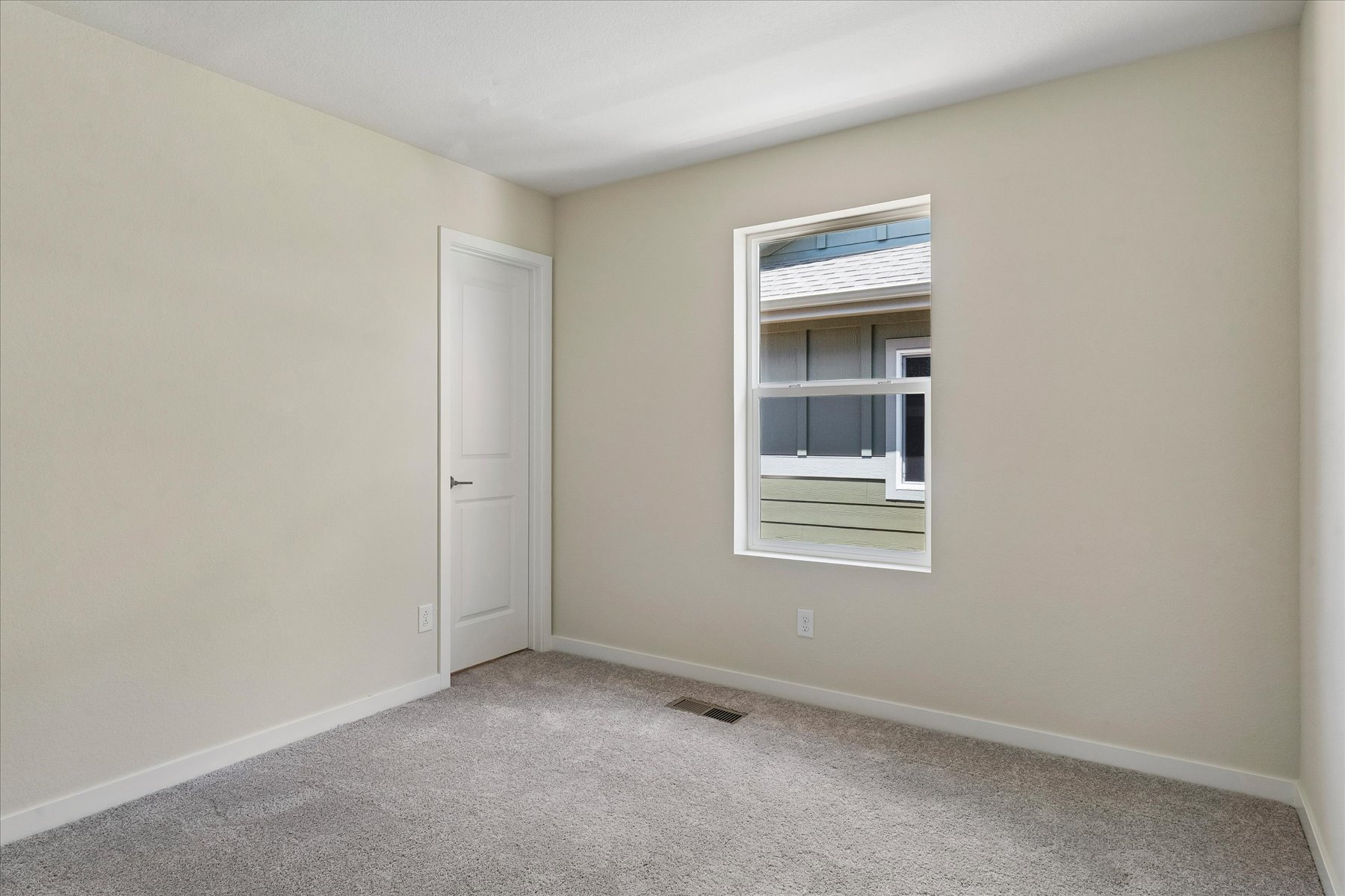 A room with a window and a door.