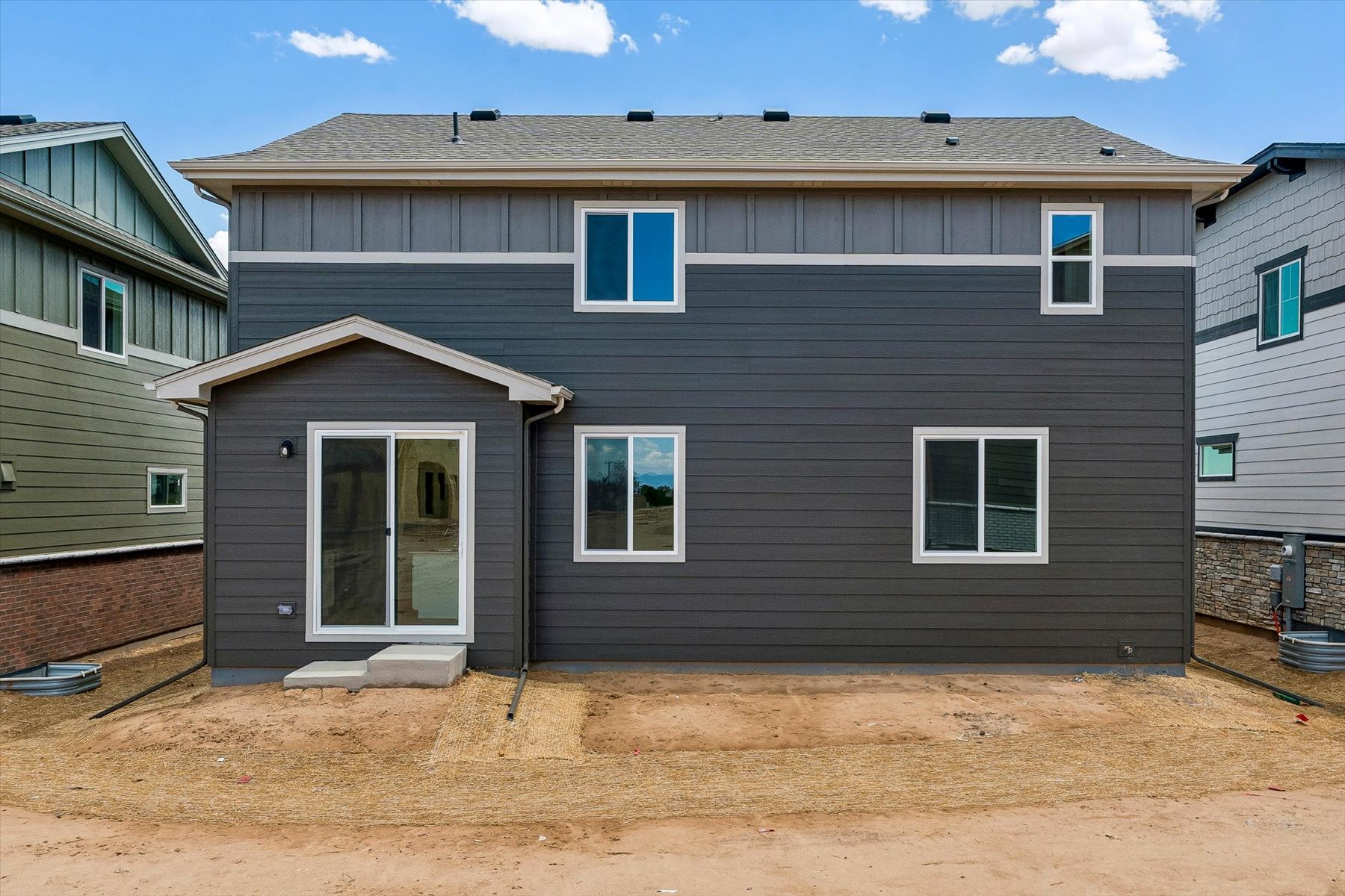 A house with a dirt yard.