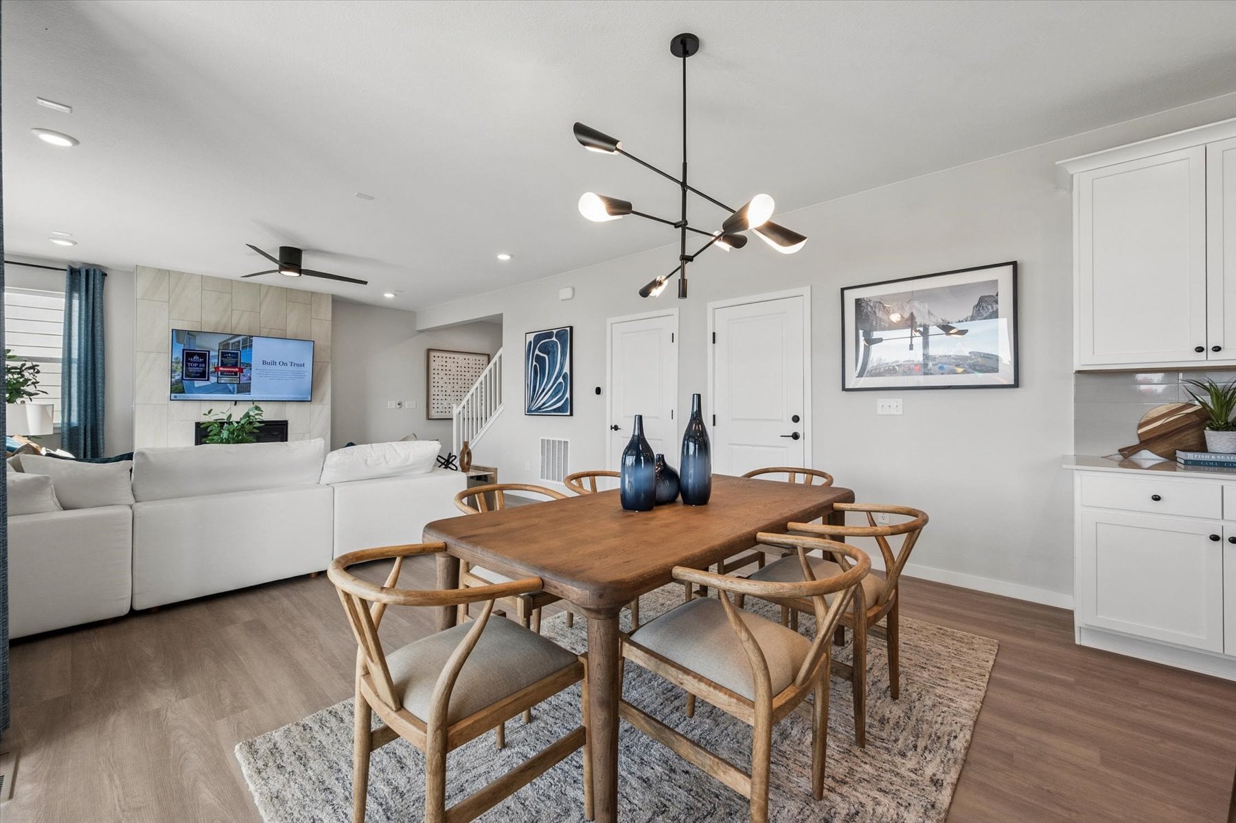 A dining room with a couch and a table.