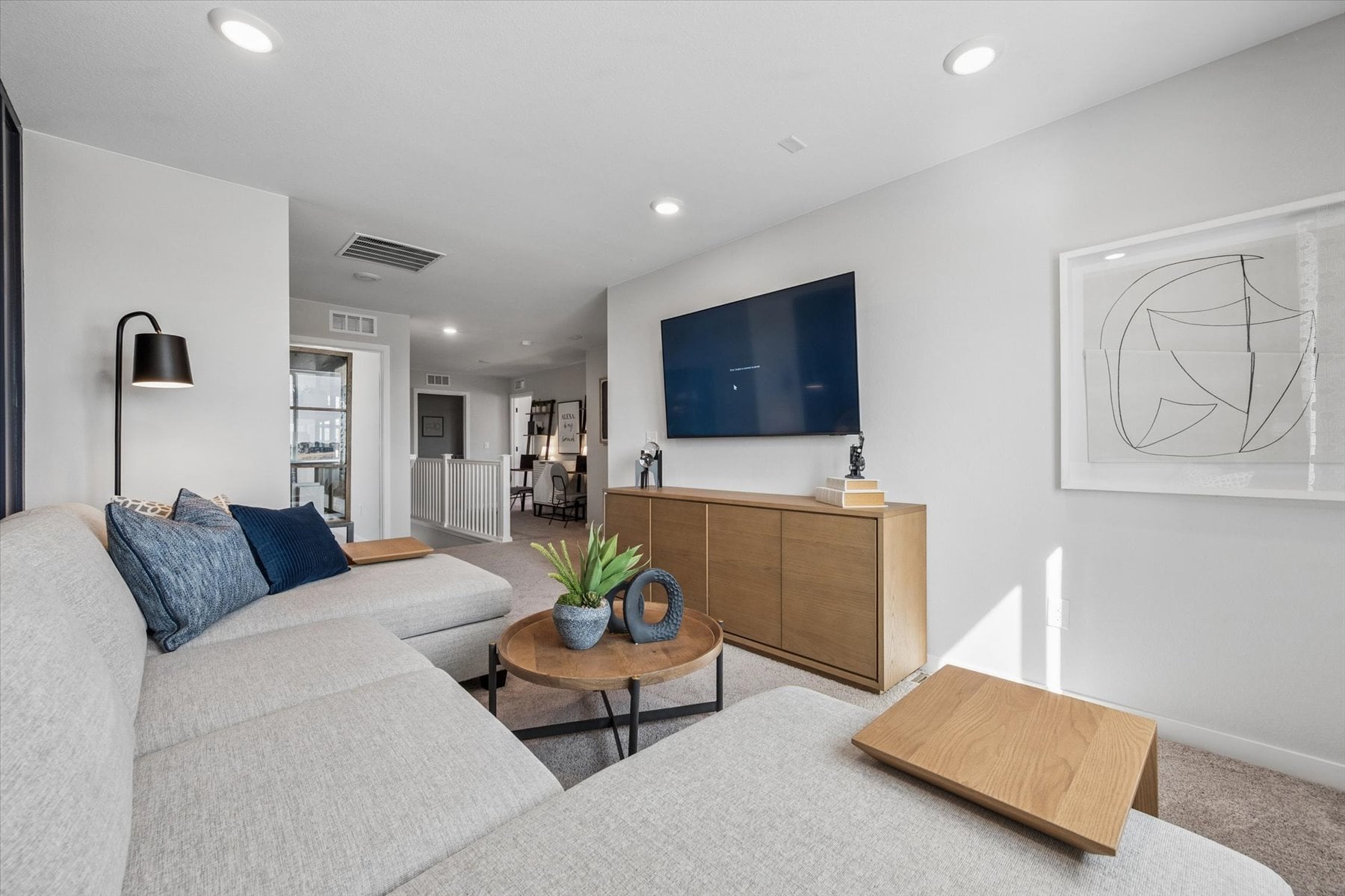 A living room with a tv and couches.