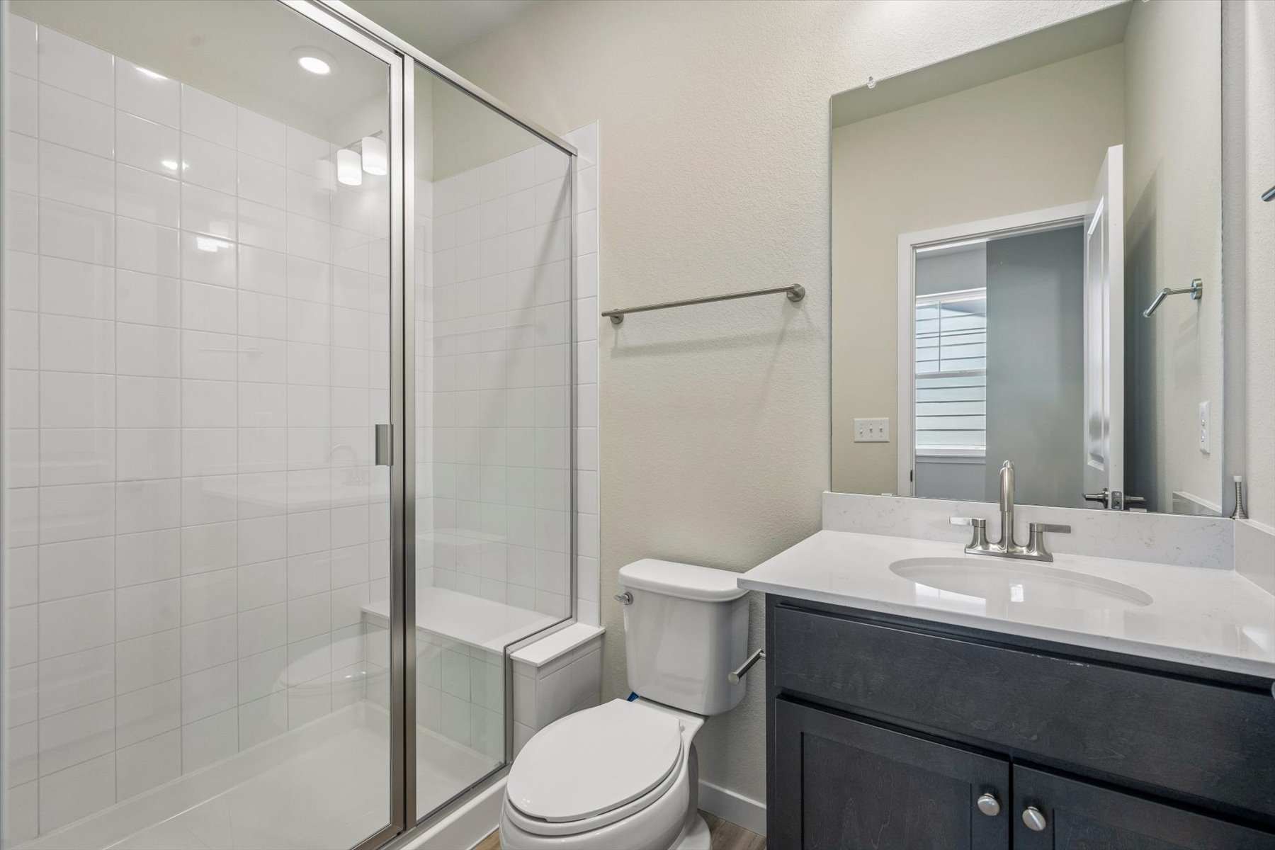 A bathroom with a glass shower.