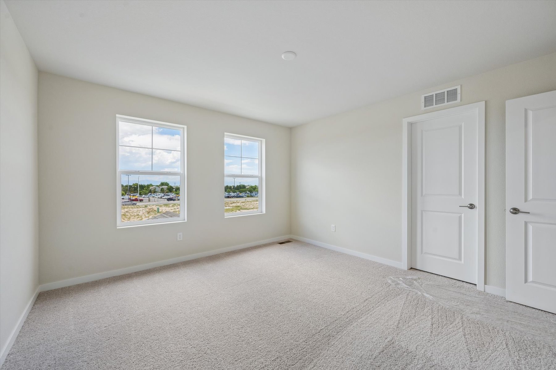 A room with white doors and windows.