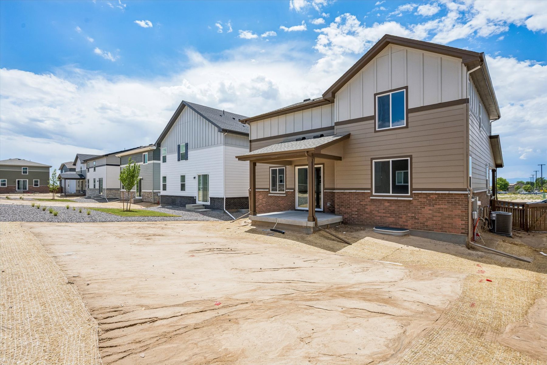A house with a dirt yard.