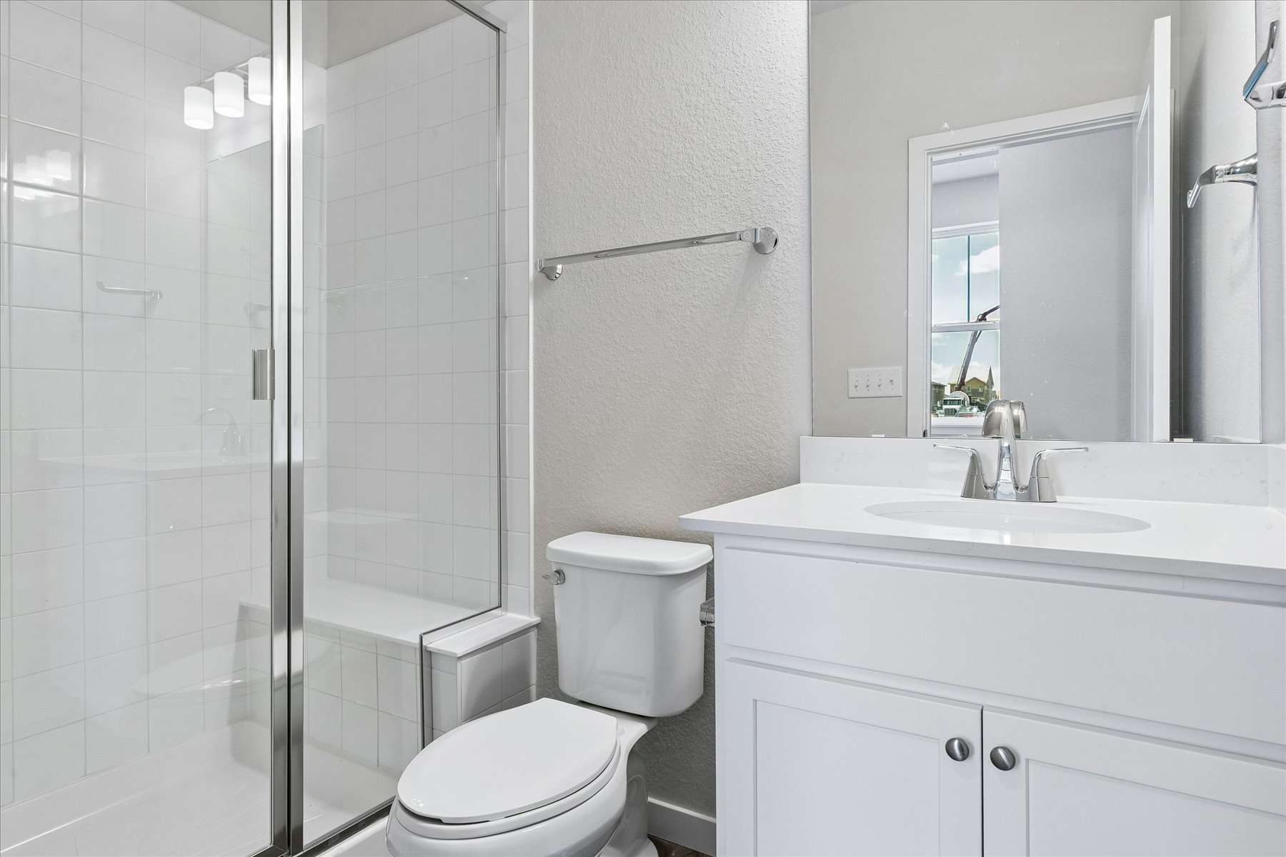 A bathroom with a glass shower.