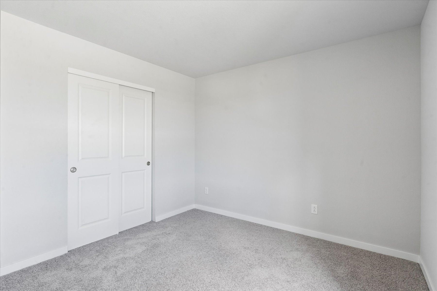 A room with white doors.