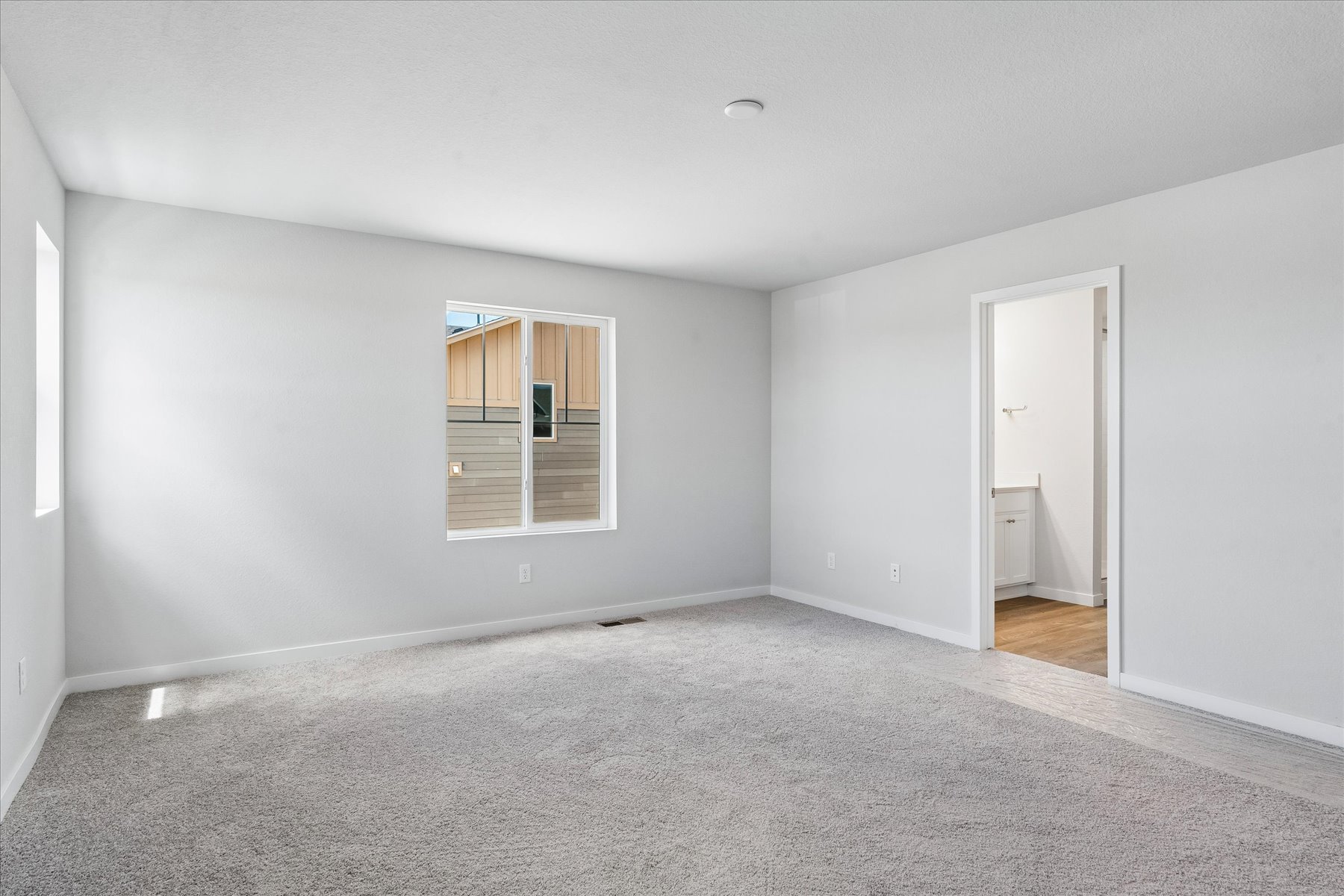 A room with a door and a window.