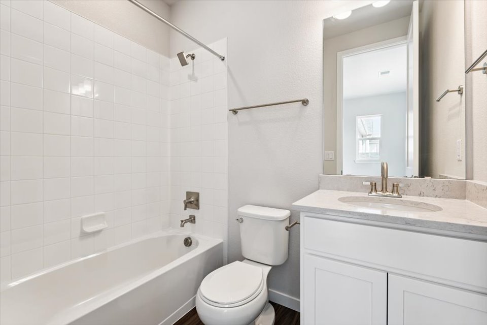 A bathroom with a toilet and sink.