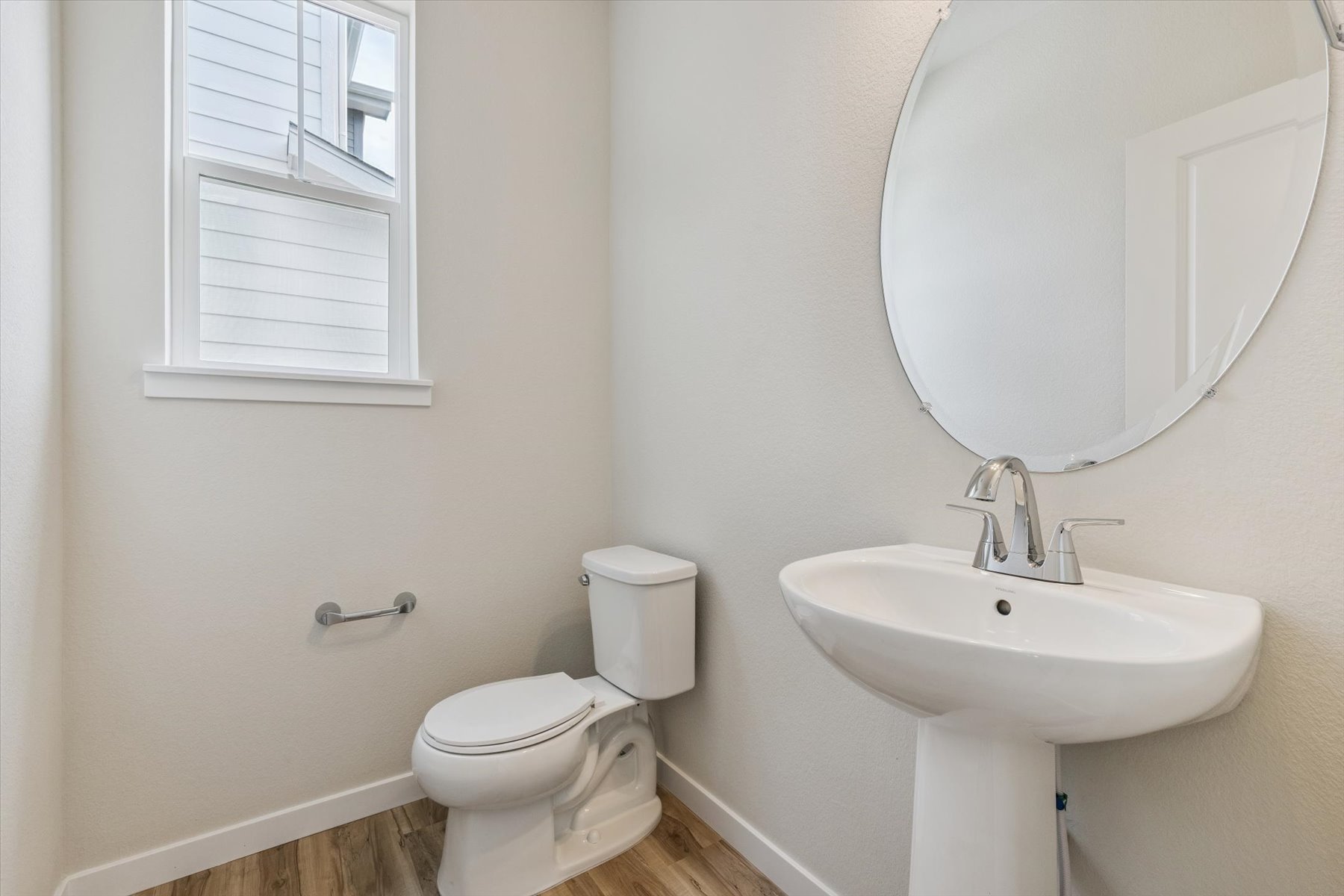 A bathroom with a sink and toilet.