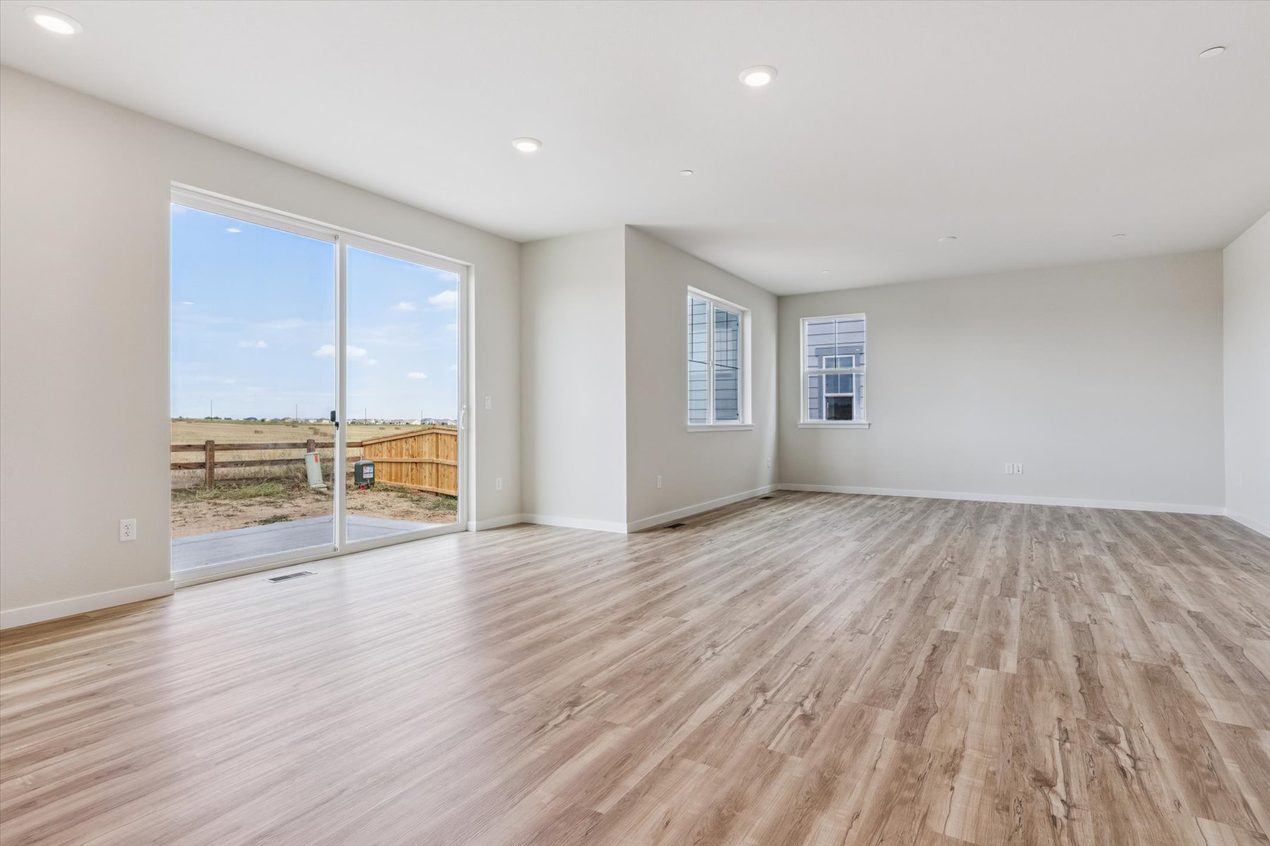 A large empty room with a large window.