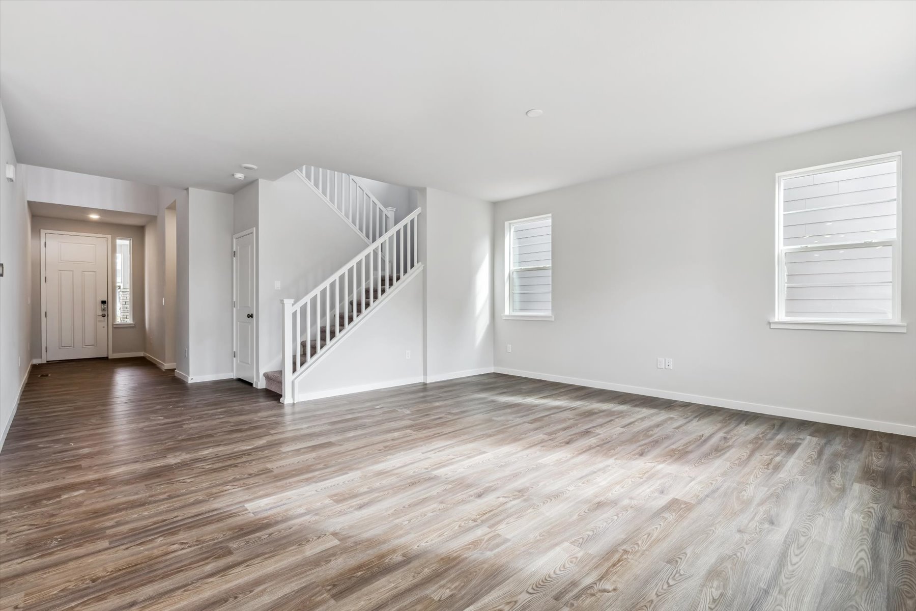 A room with a wood floor and a wood floor.