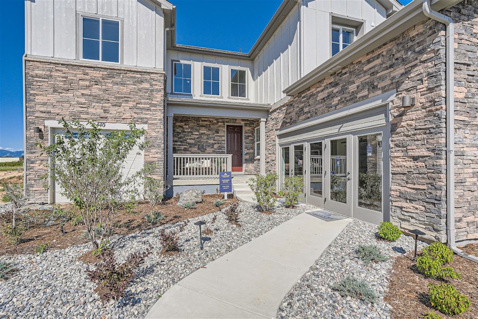 A stone walkway leading to a house.