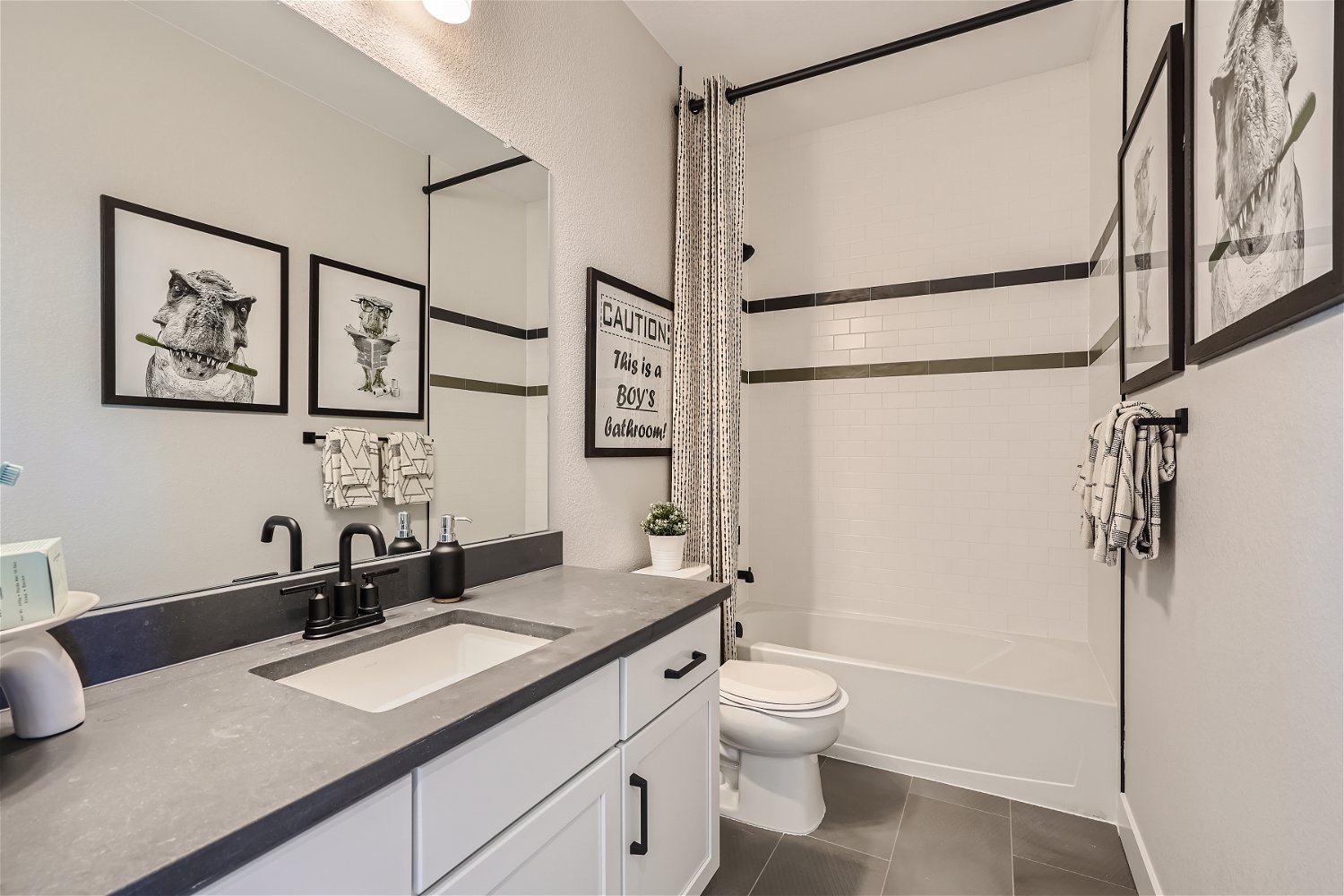A bathroom with a sink toilet and a bathtub.