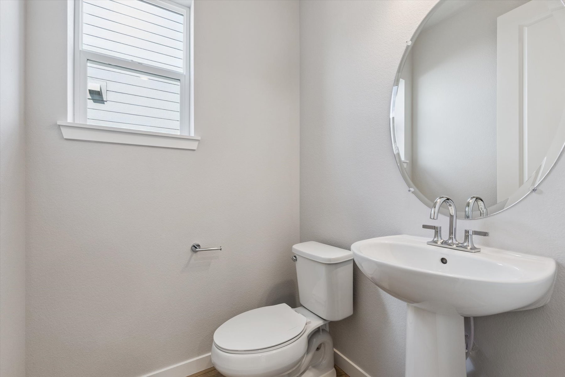 A bathroom with a sink and toilet.