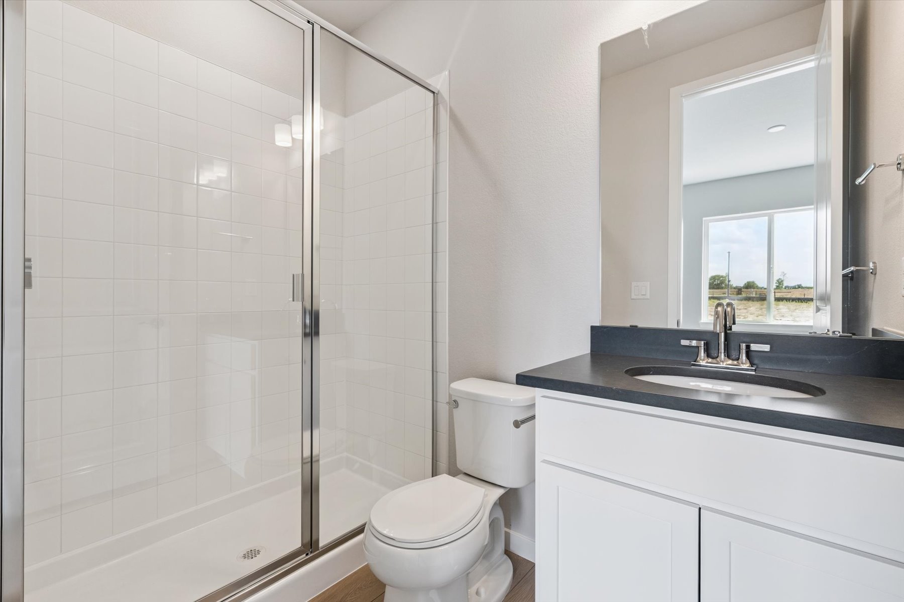 A bathroom with a glass shower.