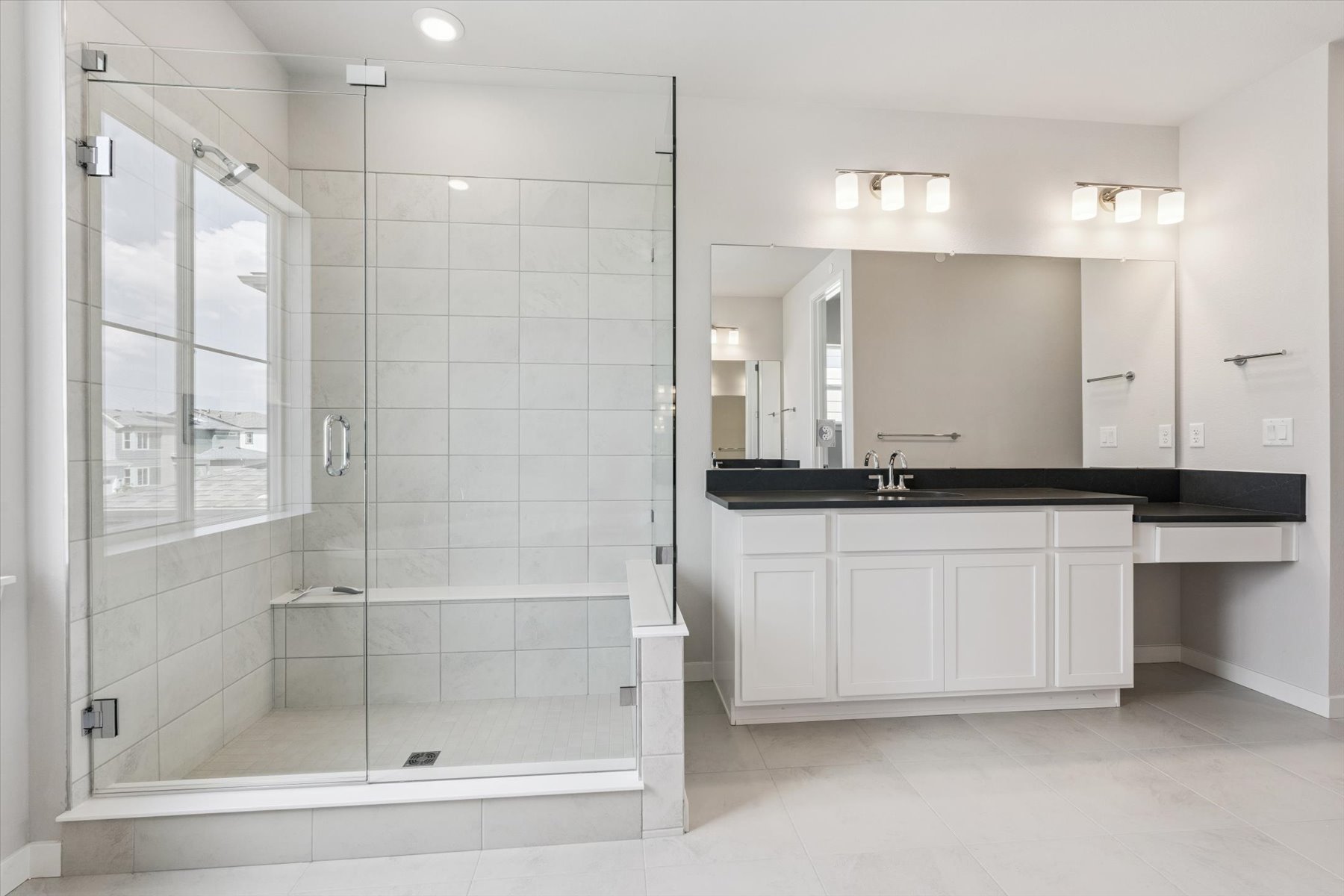 A bathroom with a glass shower.