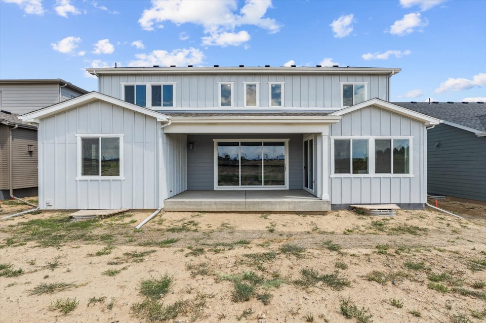 A house with a dirt yard.