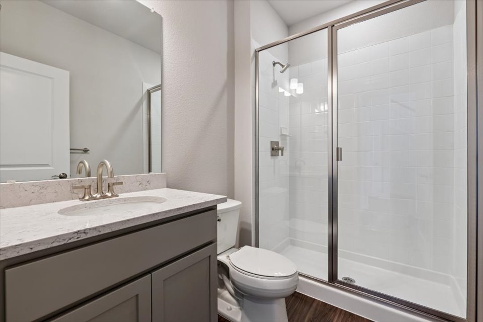 A bathroom with a glass shower.