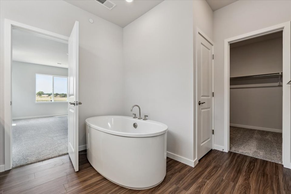A bathroom with a tub and sink.