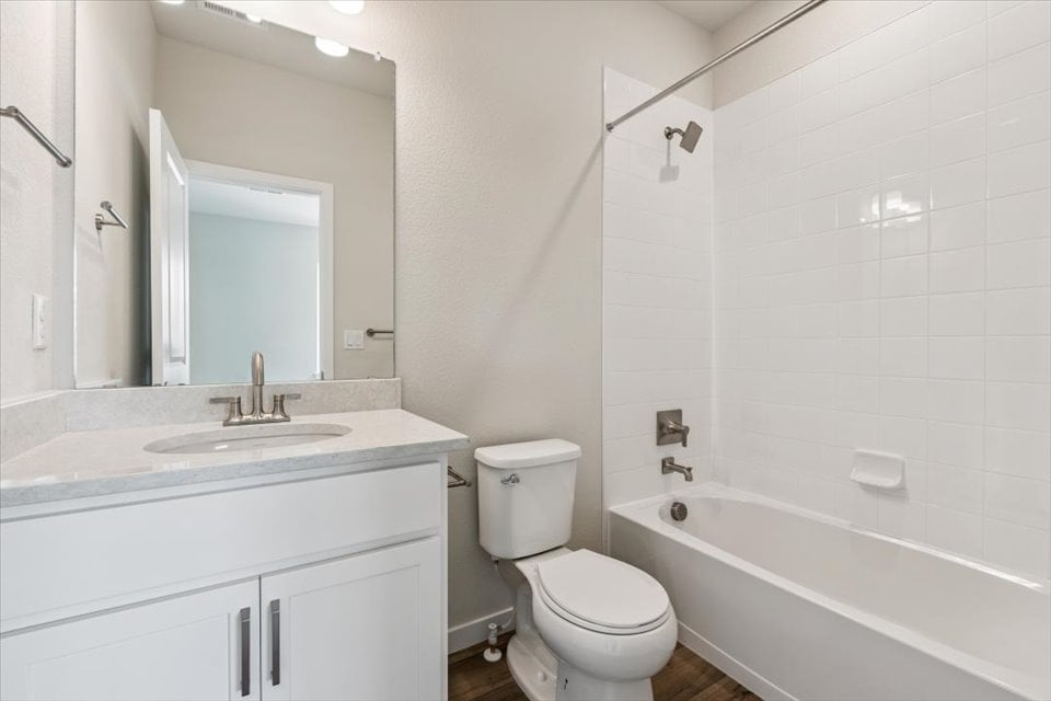 A bathroom with a toilet and sink.