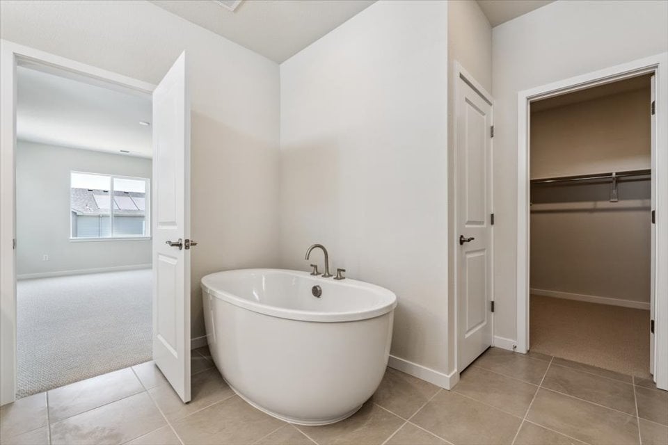 A bathroom with a tub and sink.
