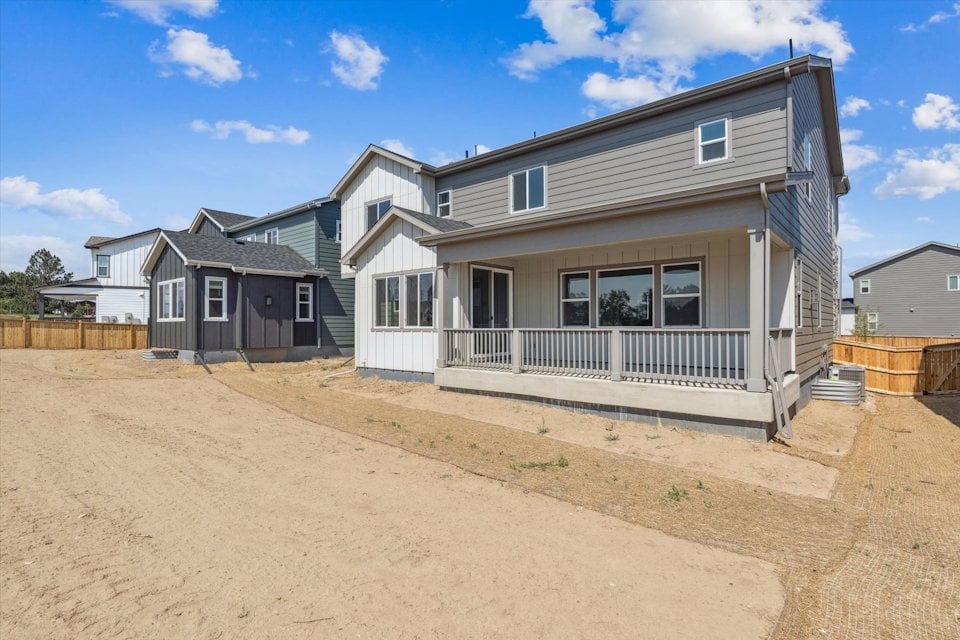 A house with a dirt yard.