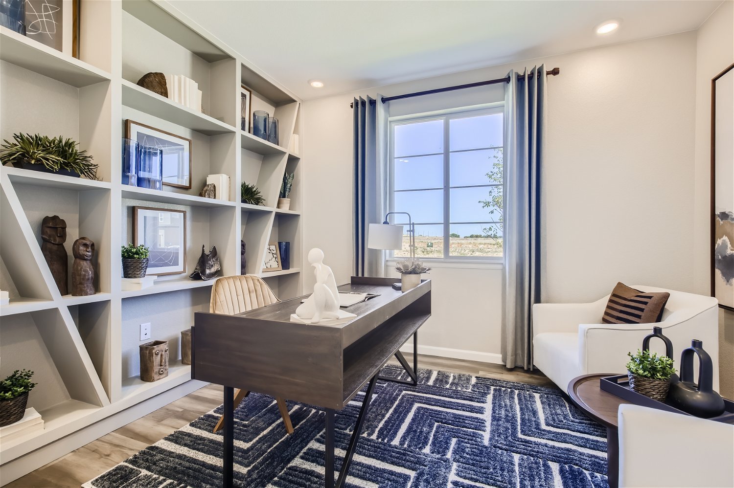 A room with a table and shelves.