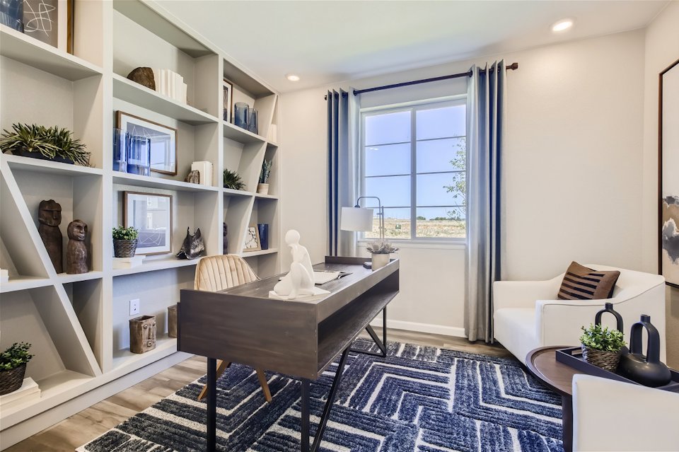 A room with a table and shelves.