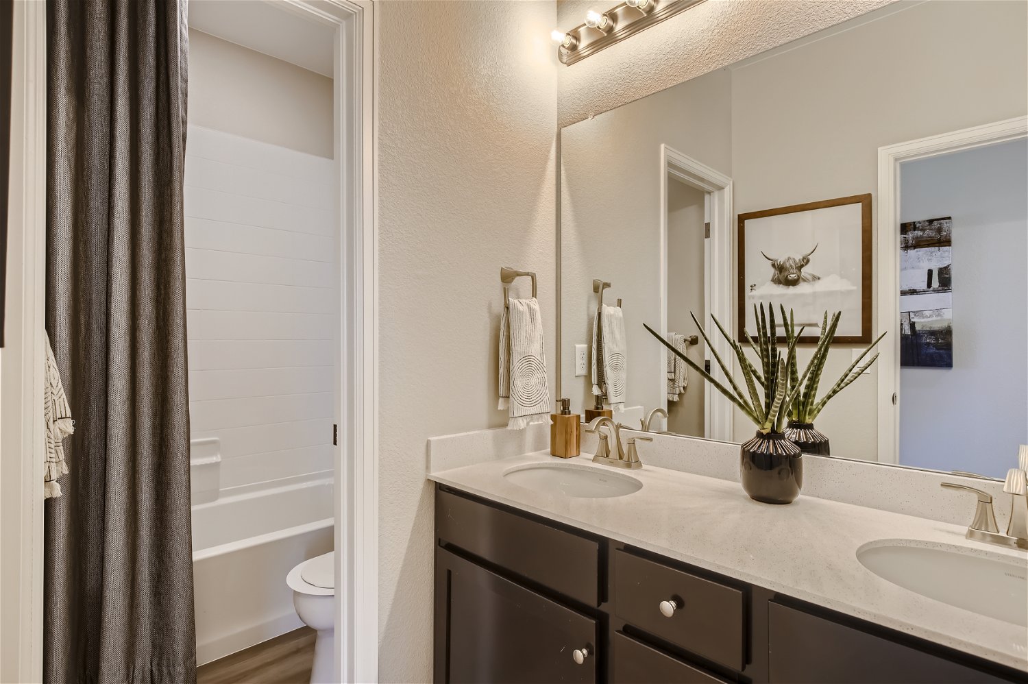 A bathroom with a sink and a toilet.