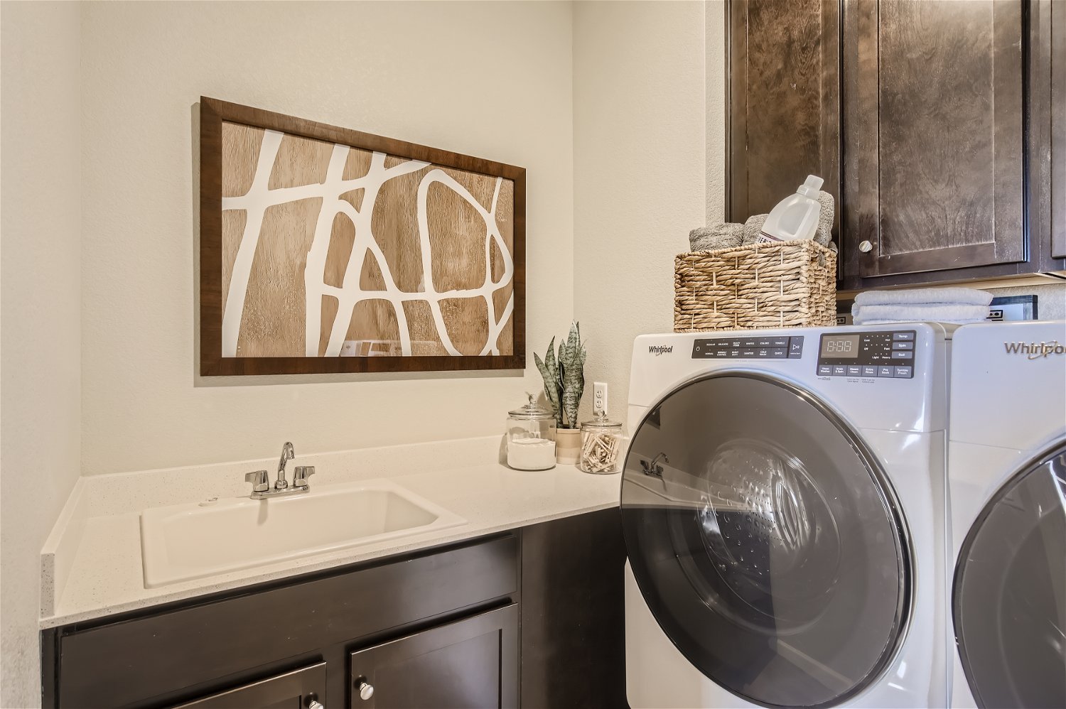 A bathroom with a washer and dryer.