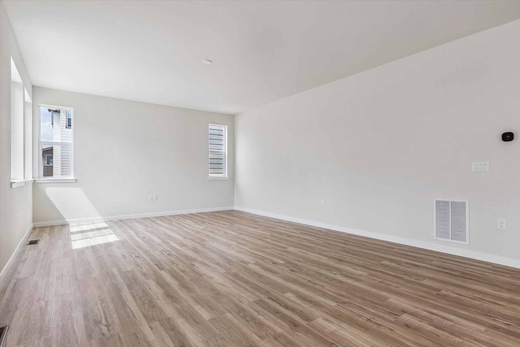 A room with a wood floor.