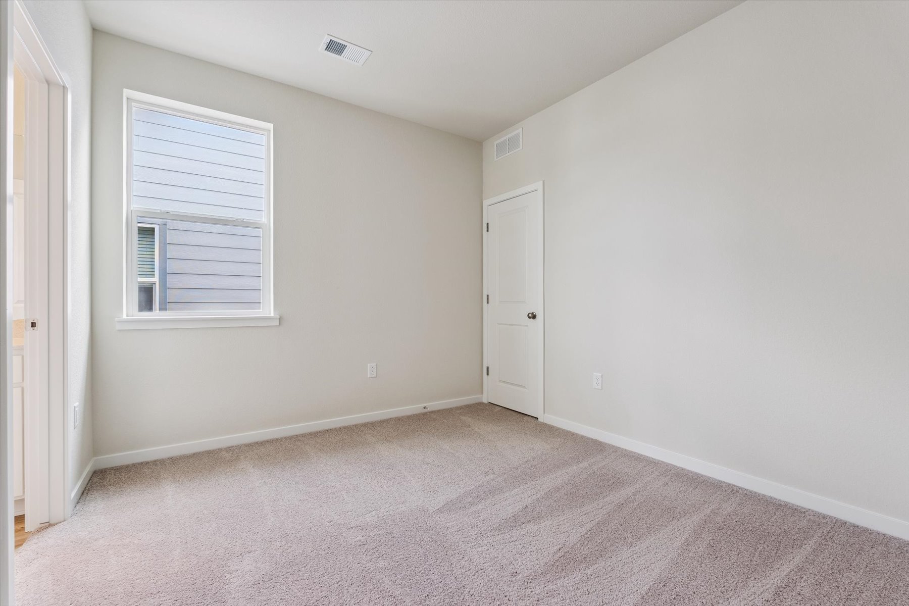 A room with a door and a window.